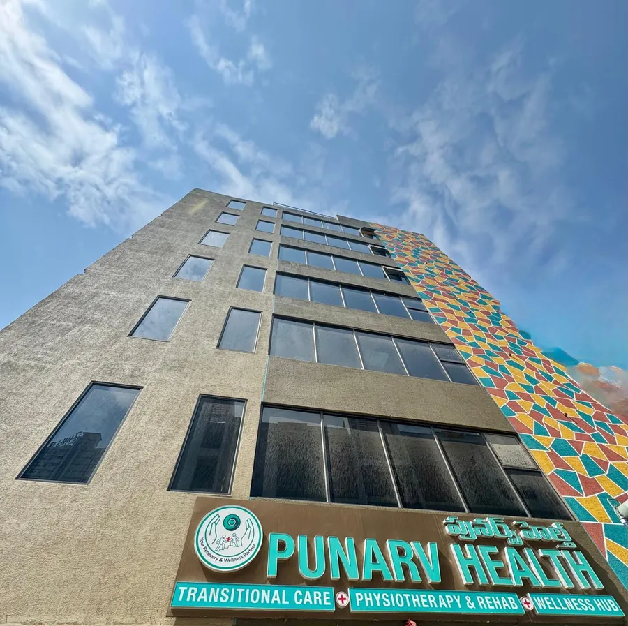 The mosaic-tile facade at the Punarv Health building entrance